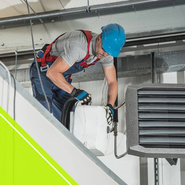 HVAC tech conducting maintenance